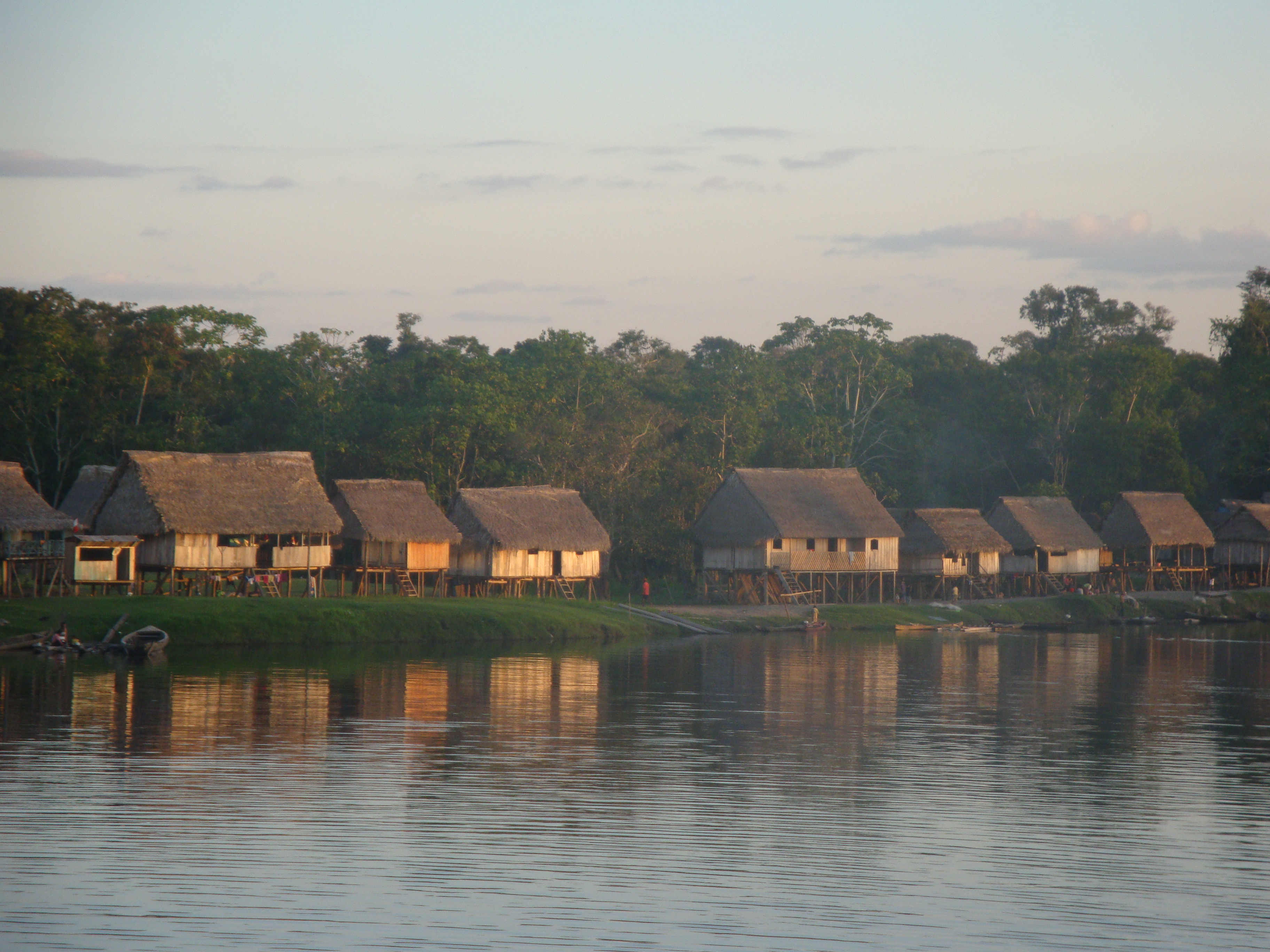 Huts on stilts close to the Amazon river in the tropical forest of South America