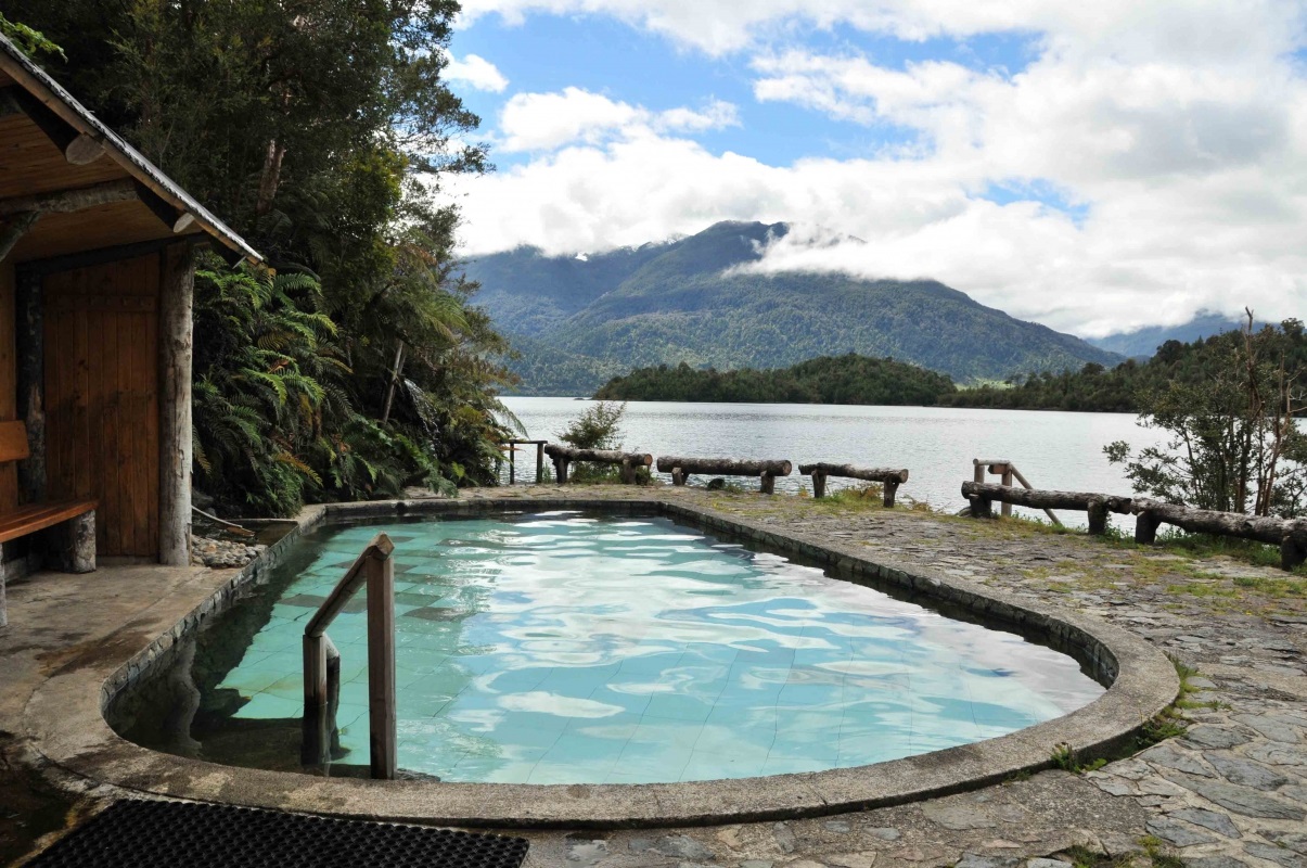 Termas de Puyuhuapi hot geothermal spa relaxing with a view on Chilean mountains