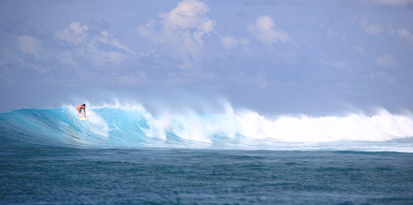 Surfing in the Maldives on your exquisitely crafted journey