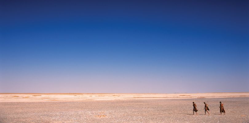 Bushmen crossing the Kalahari desert, Botswana