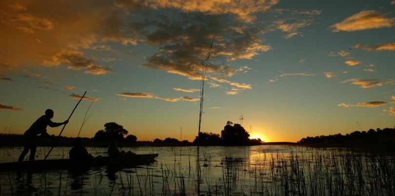 Sunset safari in canoe in the Okavango, Botswana