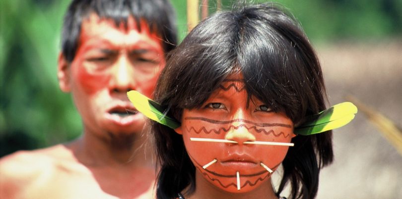 Indigenous people of a Brazilian tribe with face accessoires