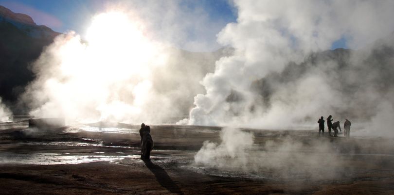 People at steaming hot springs in the Atacama desert Chile