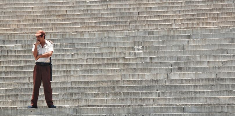 Man standing on steps in Cuba