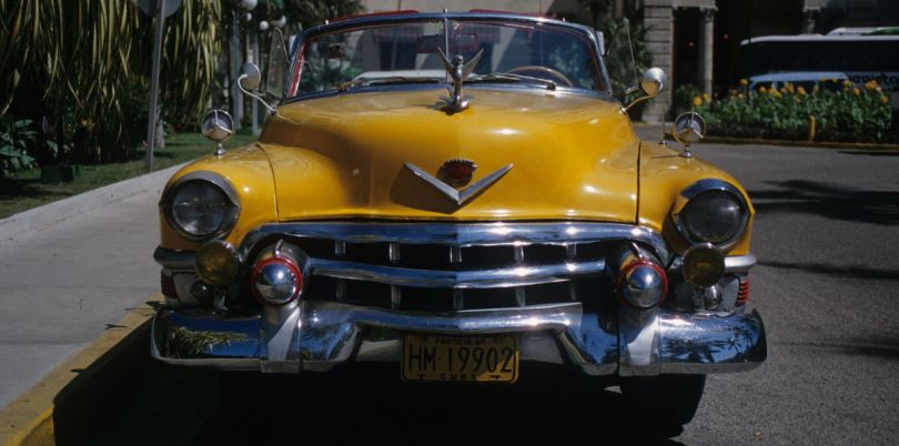 Yellow vintage car in Cuba