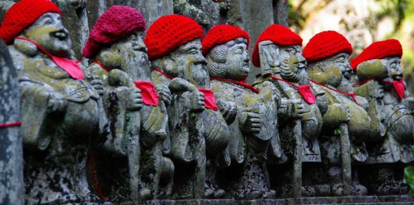 Statues in Japan with red hats on, Japan