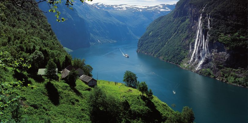 Boat going down river in the mountains, Norway