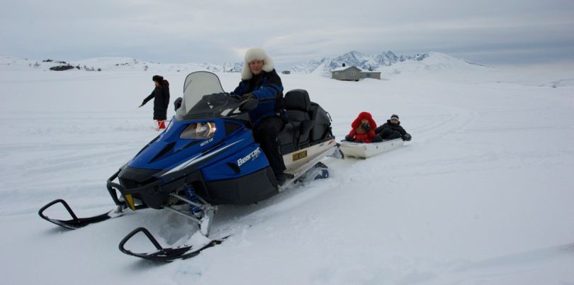 Snow mobile ride to go ice fishing, Norway