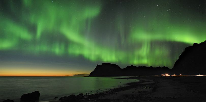 Green northern lights over the sea, Norway