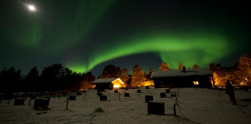 Green northern lights over a village, Norway