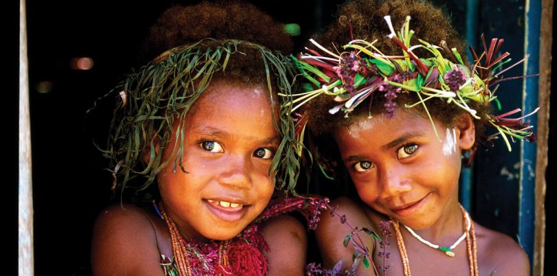 Two young girls from Papua New Guinea with hair accessories