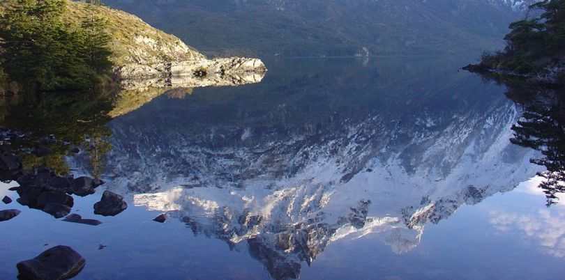 Reflection of the mountains in Andes lake Patagonia