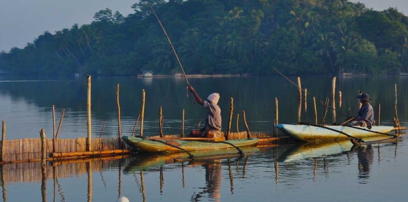 Fishermen in canoes in Sri Lanka