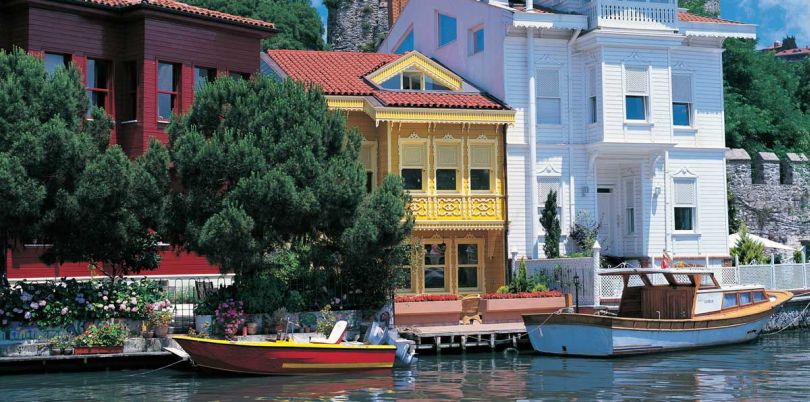 Colourful houses with landed boats at the Bosphorus in Turkey