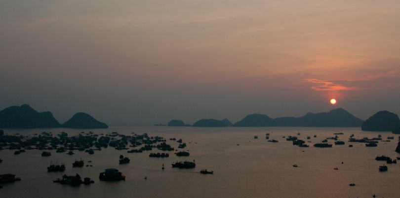 Boats at dawn in Ha Long Bay Vietnam